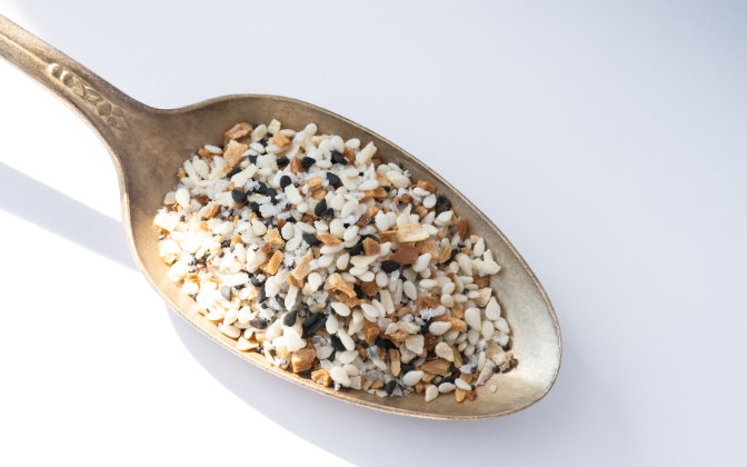 Sprinkling Everything Bagel seasoning, a key low carb pantry essential