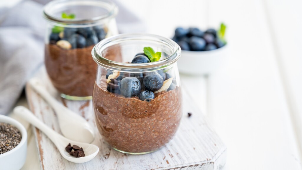 Chia pudding with blueberries, nuts, and seeds as a skin-supporting healthy fat meal.
