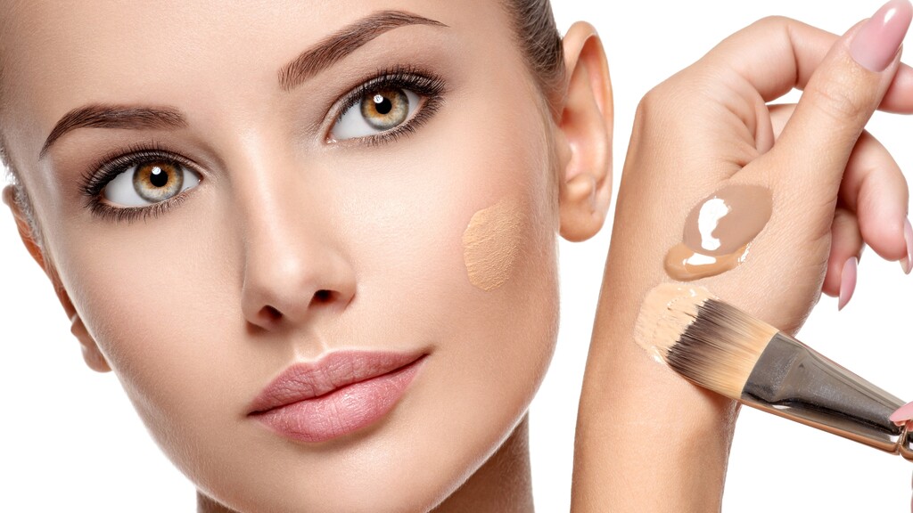 Hydrating liquid foundation being applied with a brush for smooth, dry-skin-friendly makeup.