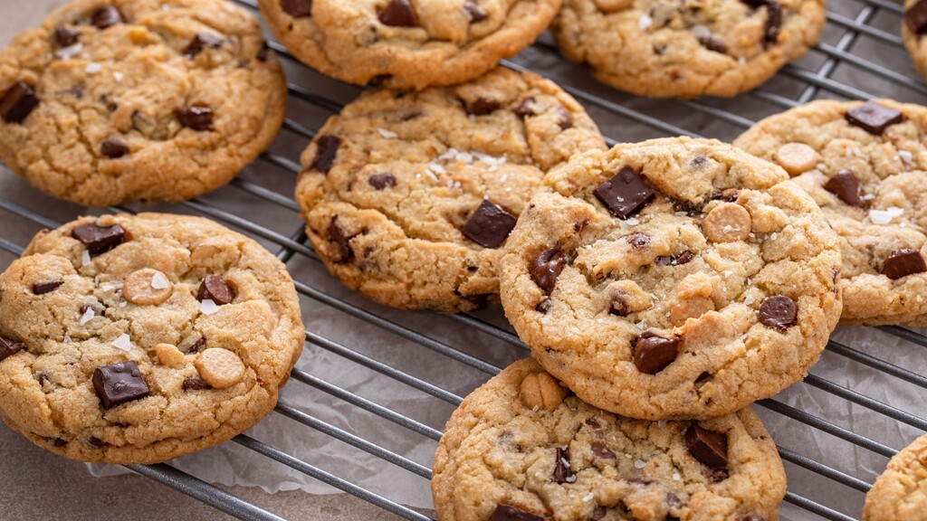Soft chocolate chip cookies cooling on a wire rack.